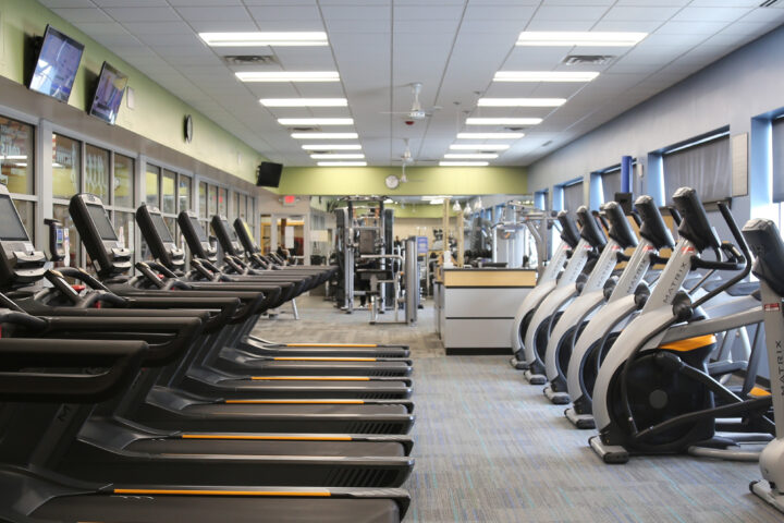 Treadmills and exercise bikes within a gym